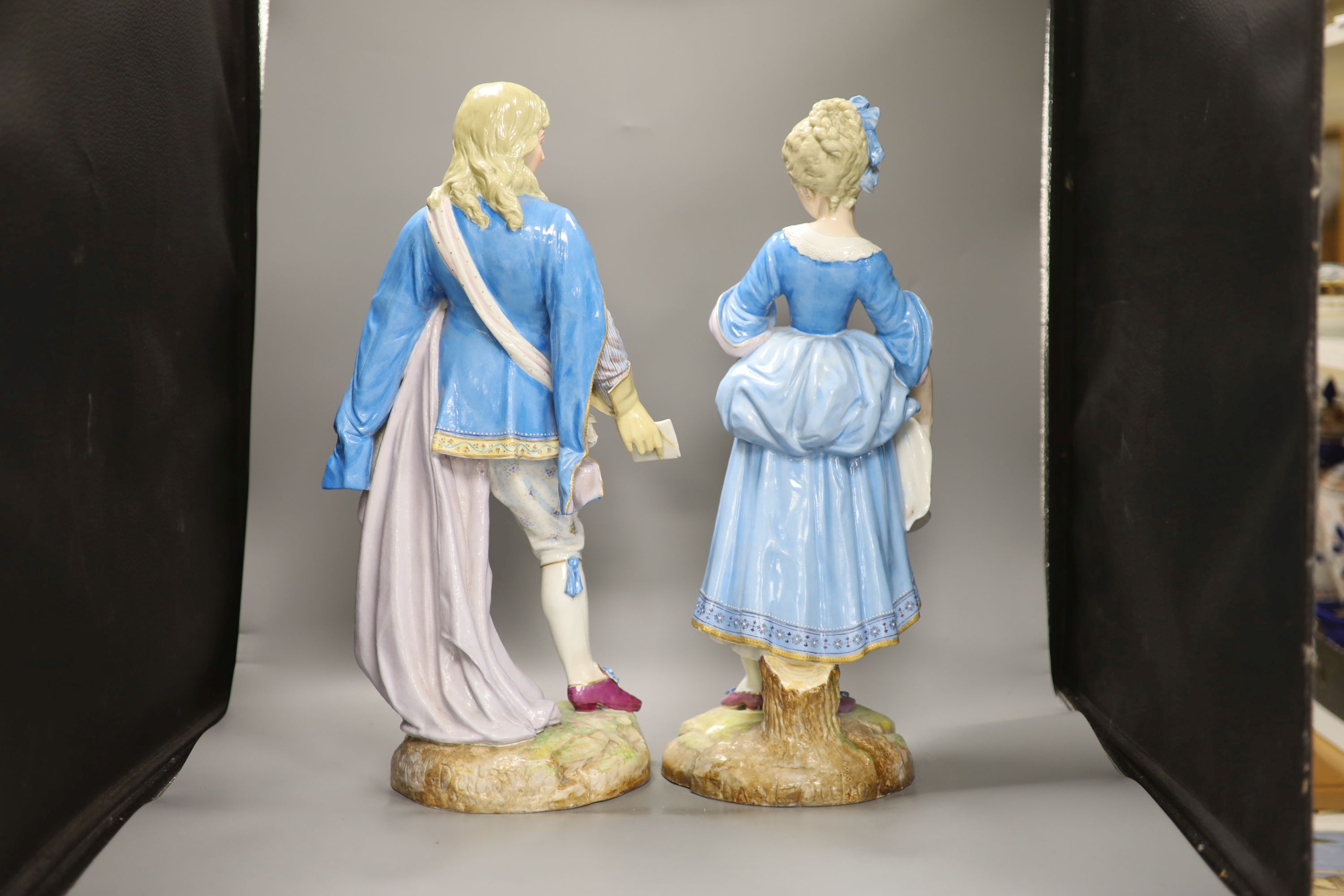 A pair of large Paris porcelain figures of a lady and gent, tallest 52.5cm